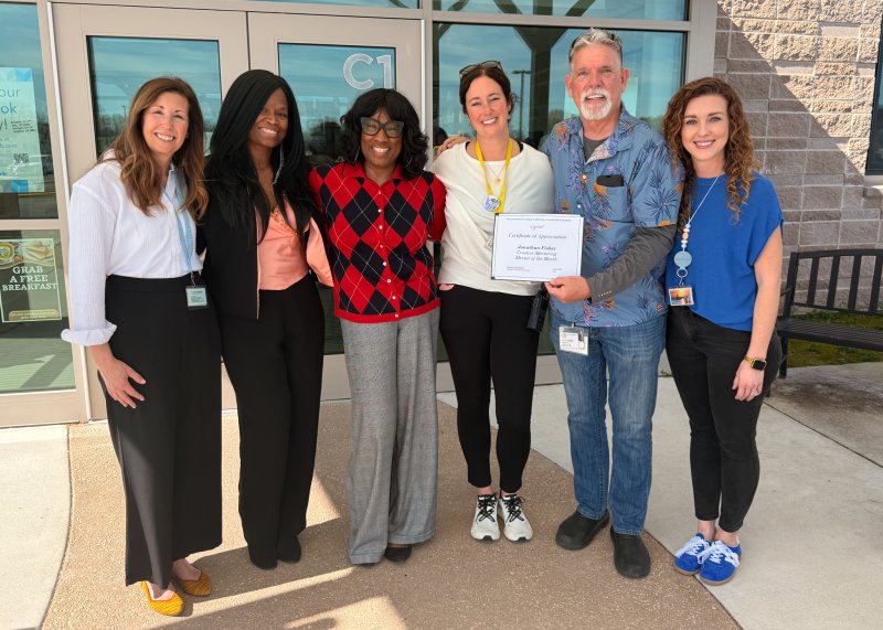 Gathered to celebrate Jon Fisher’s selection as the Connecting Generations Mentor of the Month are (l-r) Stephanie Mastrangelo, district mentor coordinator; Connecting Generations team members Cassandra McKay and Tanny Dickerson; HOB Assistant Principal Julie Hickman; Fisher; and HOB Mentor Coordinator Jessica McLaren.